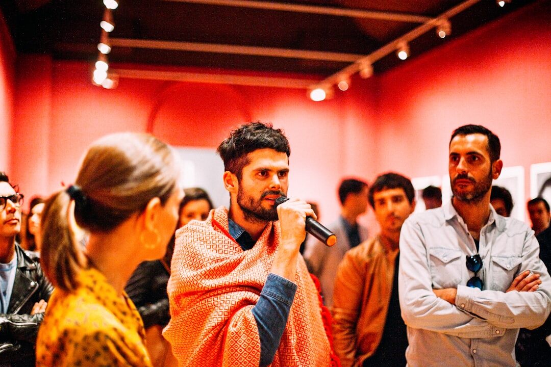 Group of people practicing public speaking in a workshop